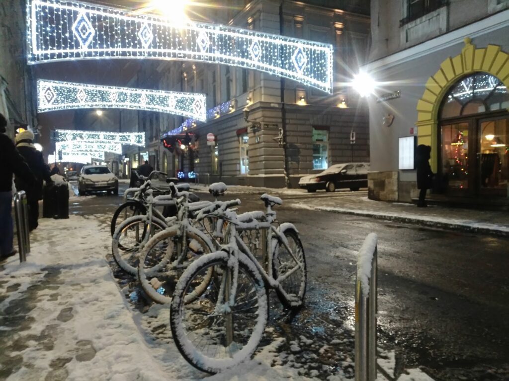 Snow covered bicycles on Tomasza Street Kraków